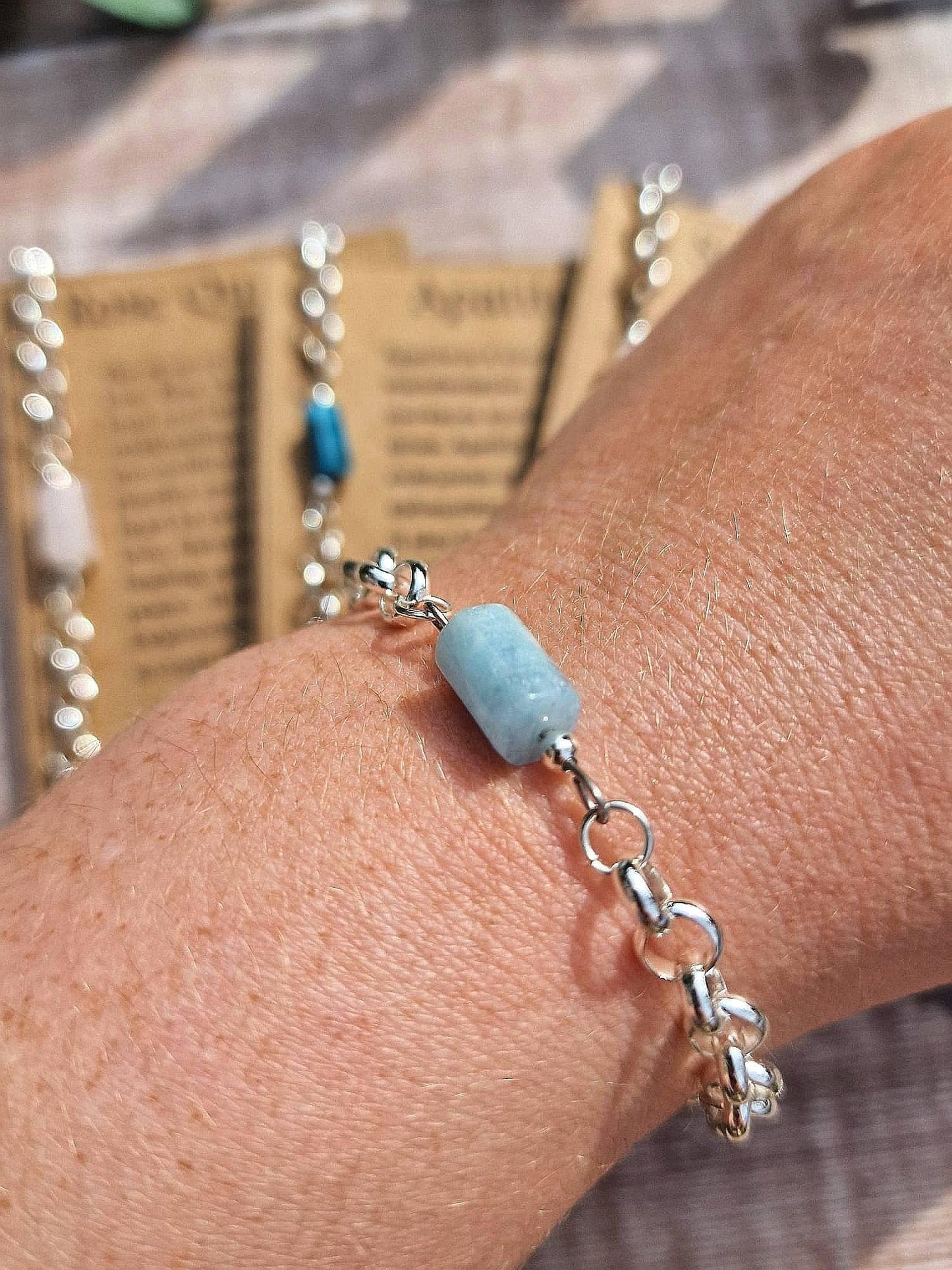 Apatite, aquamarine, Rose quartzor Sunstone chunky silver chain crystal bracelet on a descriptive Card.