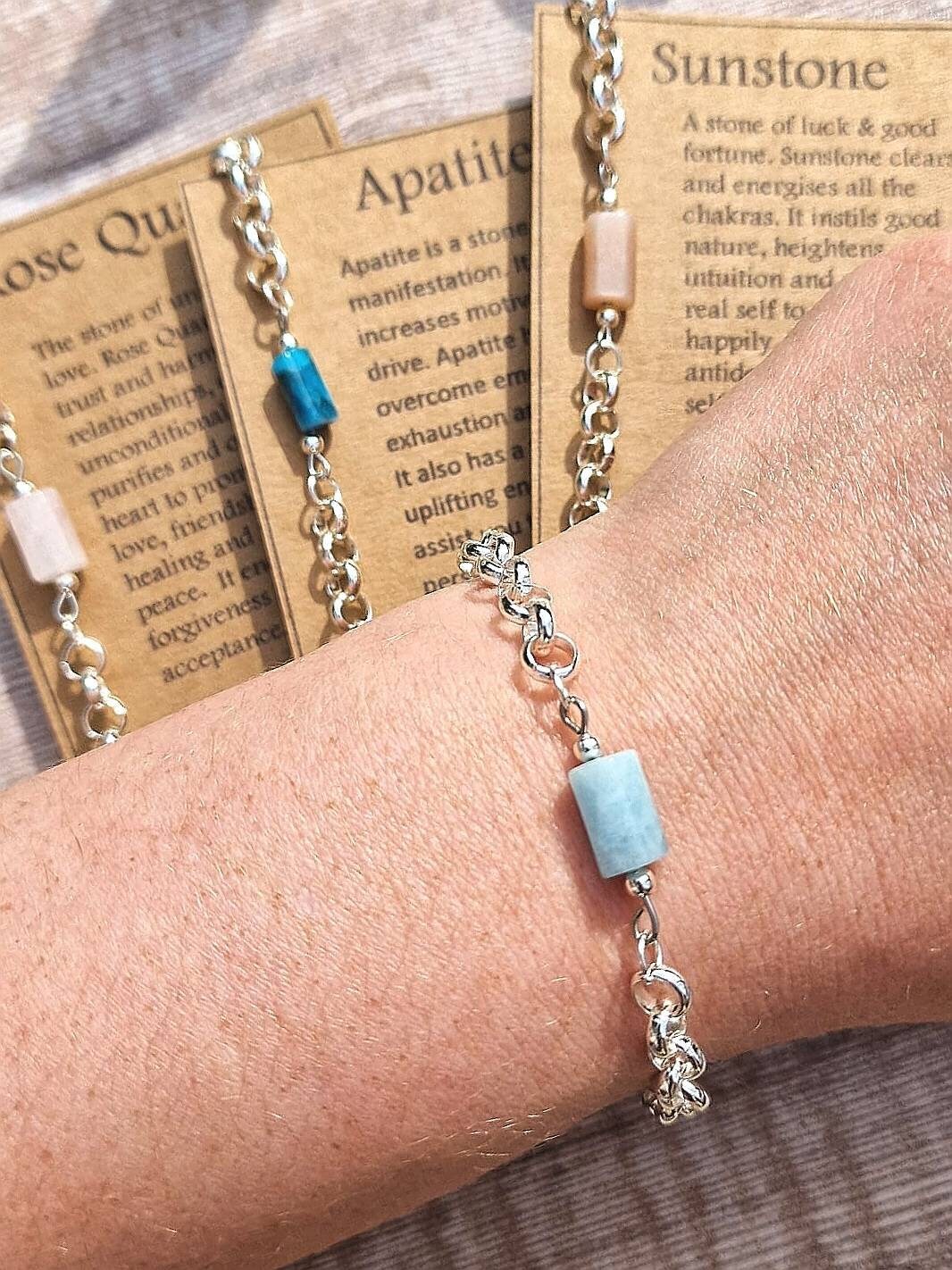 Apatite, aquamarine, Rose quartzor Sunstone chunky silver chain crystal bracelet on a descriptive Card.