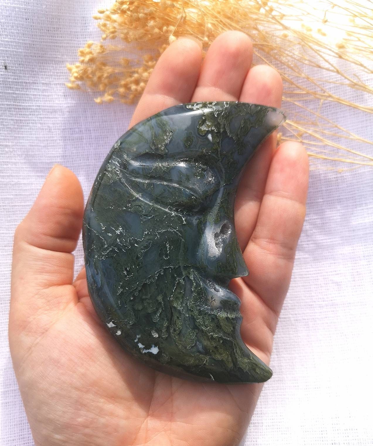 Large moss agate half moon face carving with druzy