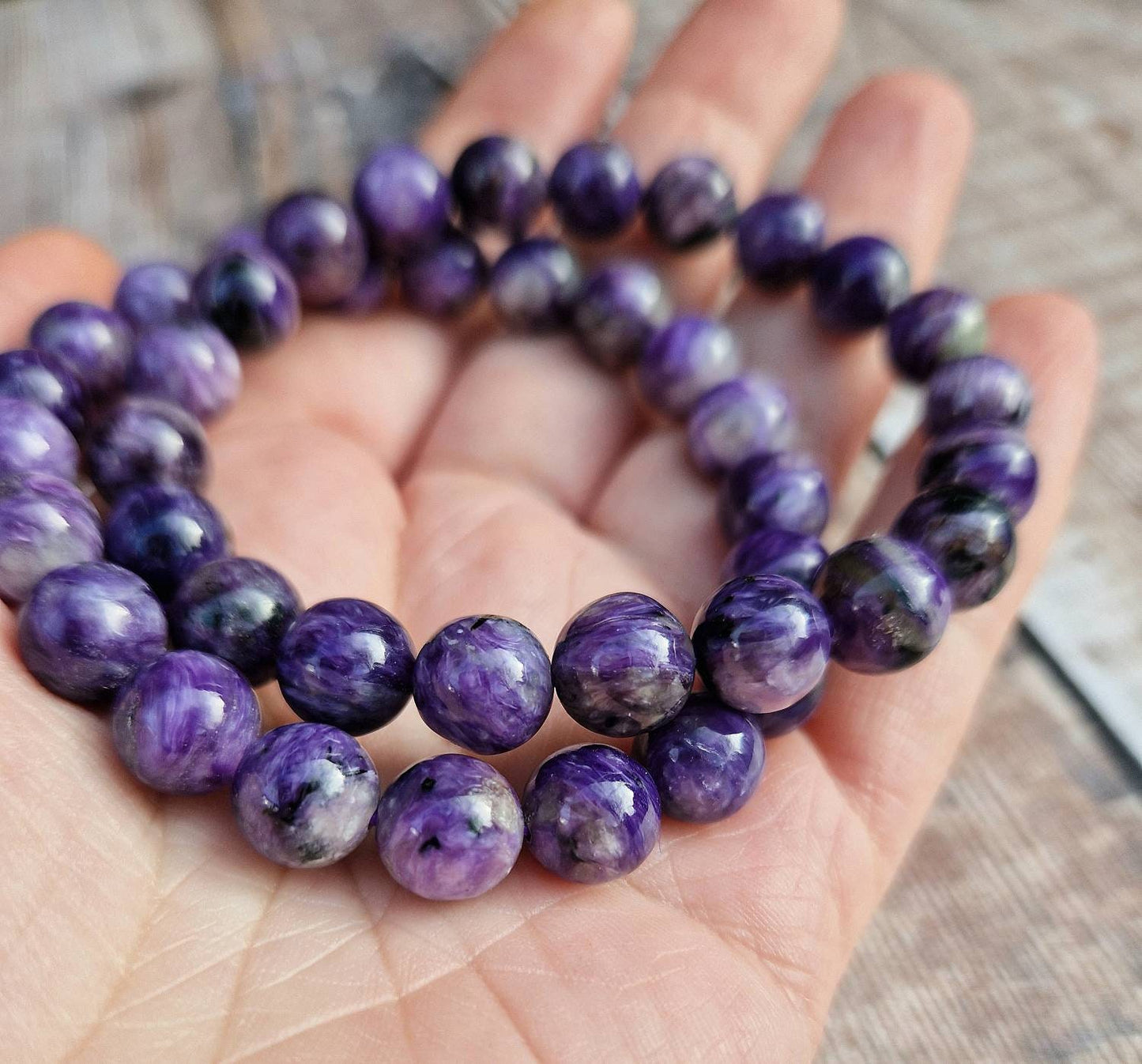 Beautiful 8mm Charoite beaded bracelet.