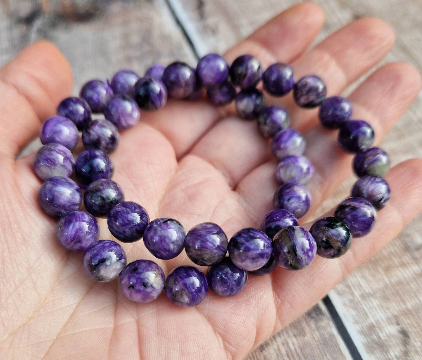 Beautiful 8mm Charoite beaded bracelet.
