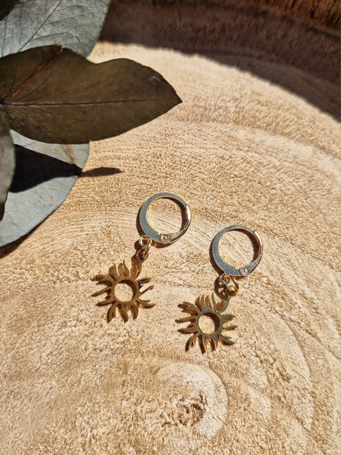 Beautiful minimalist gold sun huggie hoop earrings