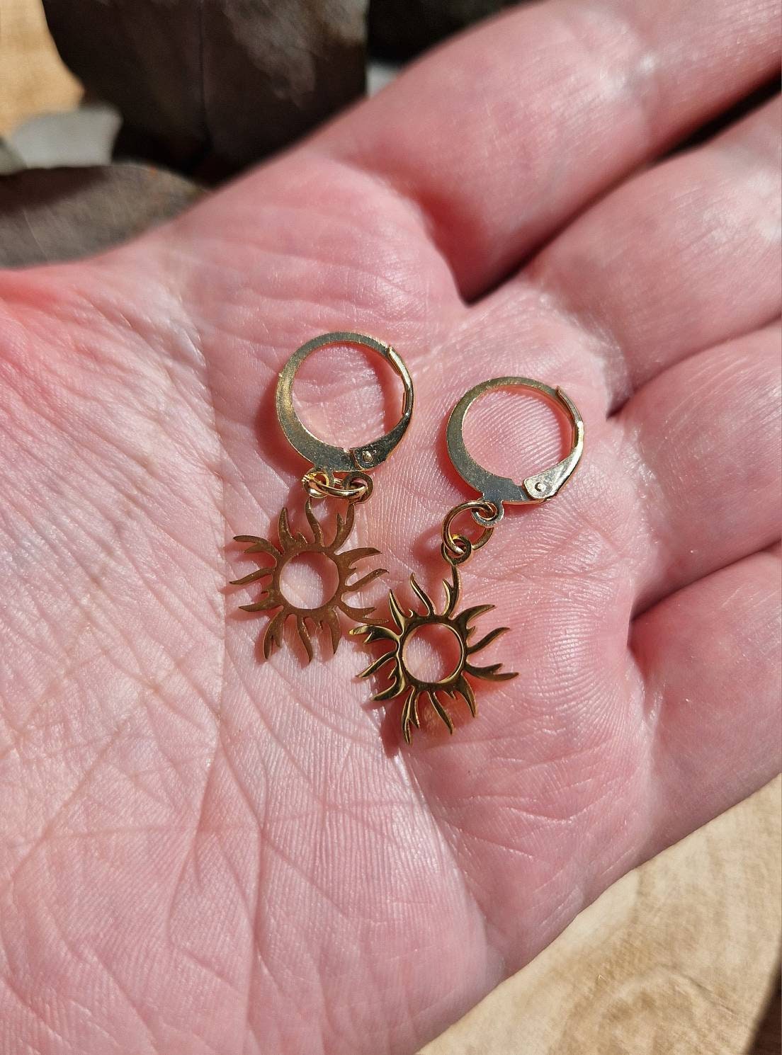 Beautiful minimalist gold sun huggie hoop earrings