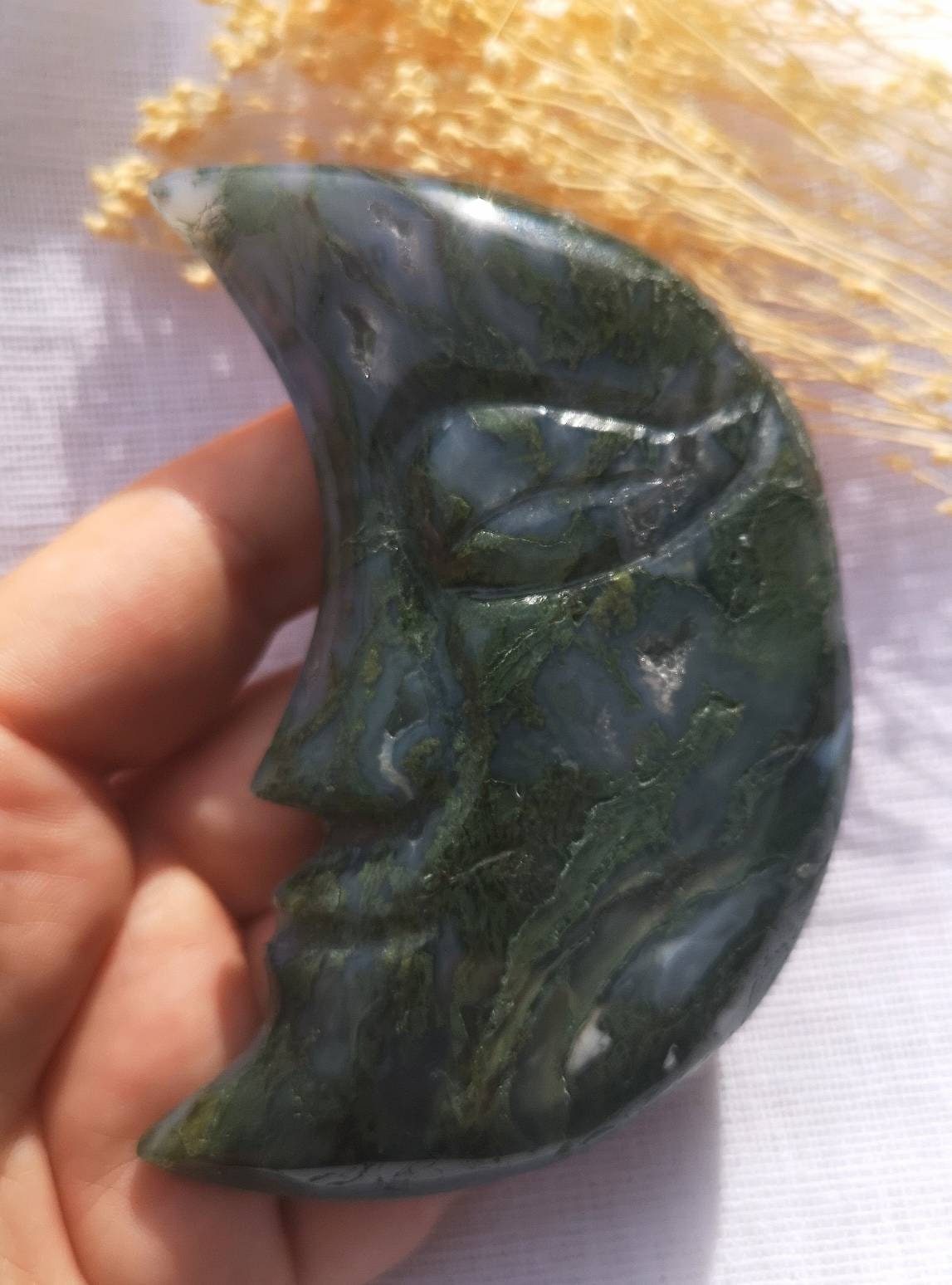 Large moss agate half moon face carving with druzy