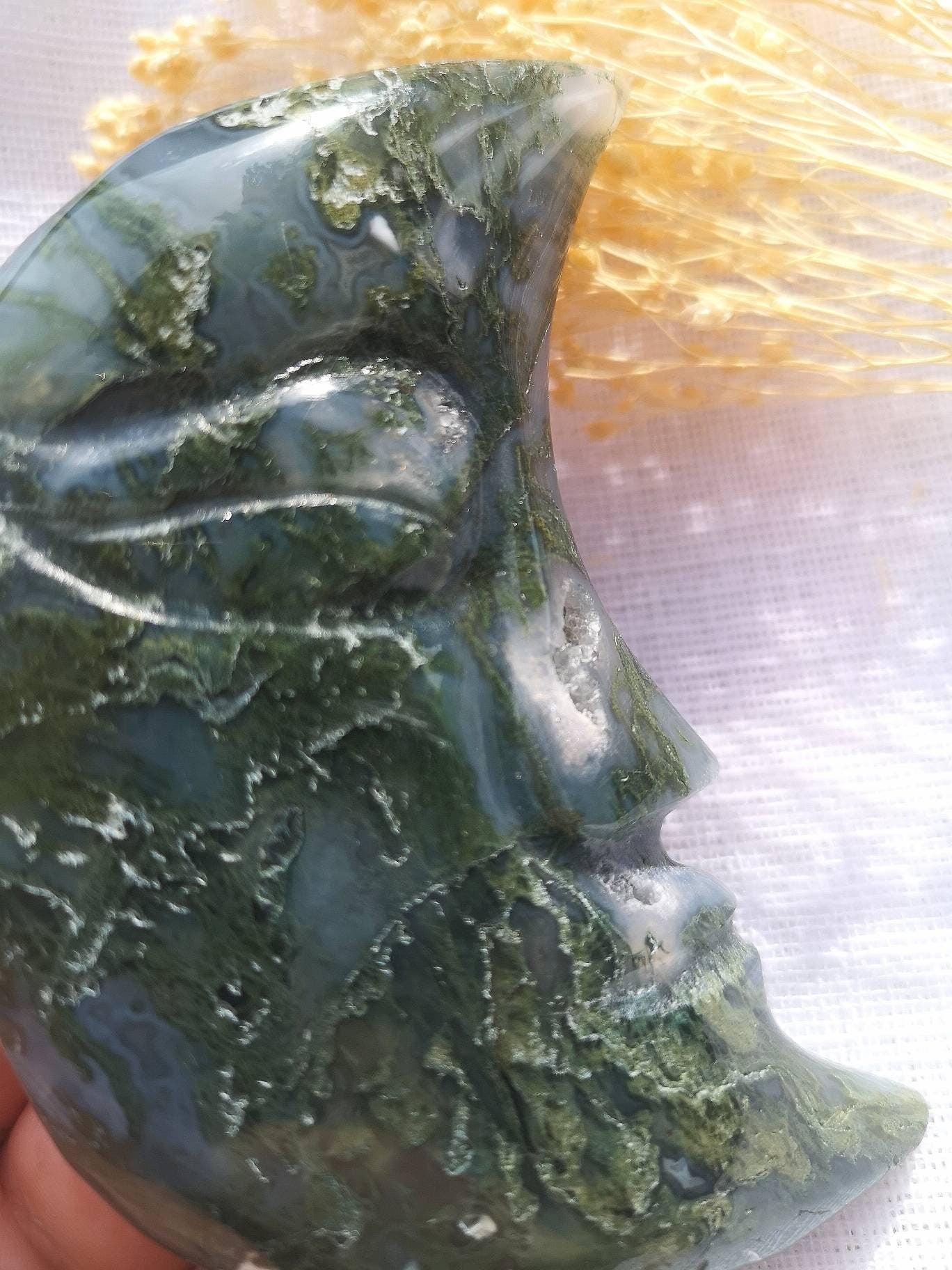 Large moss agate half moon face carving with druzy