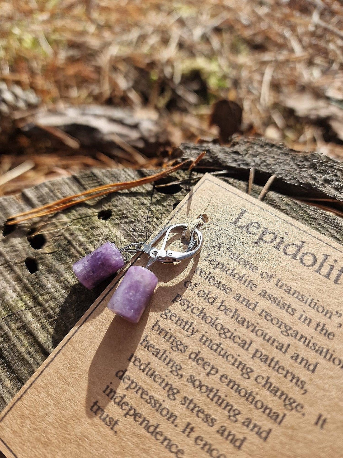 Beautiful Surgical steel Lepidolite huggie hoop earrings on a descriptive card