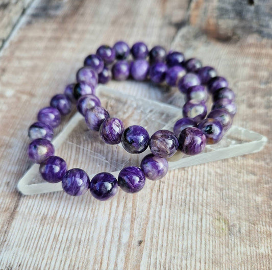 Beautiful 8mm Charoite beaded bracelet.