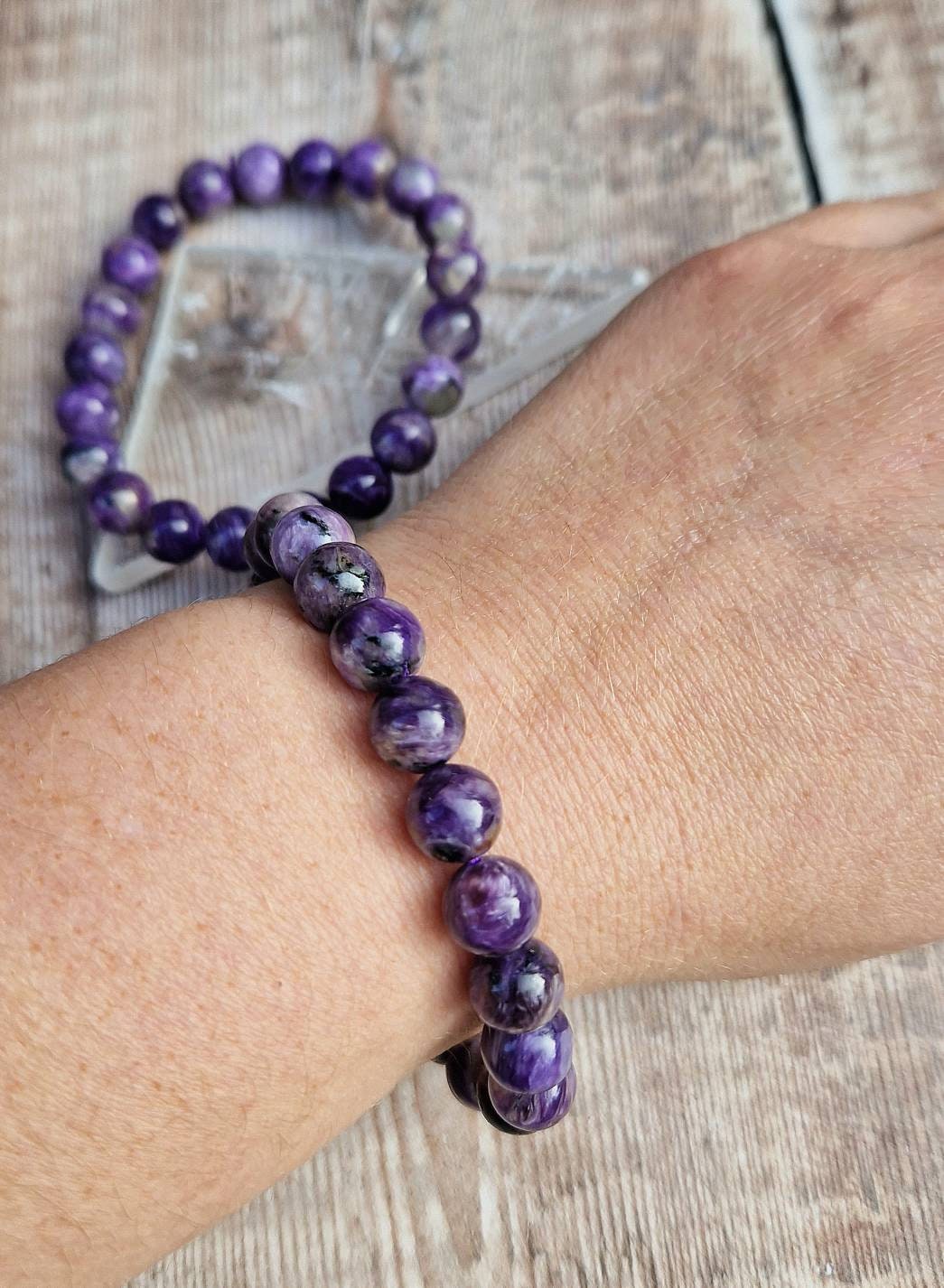 Beautiful 8mm Charoite beaded bracelet.