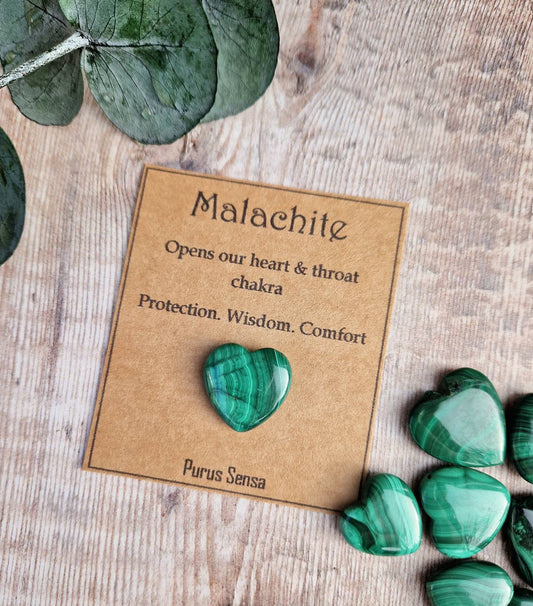 Genuine malachite heart crystal on a descriptive card